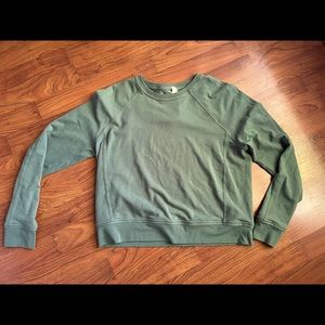 Sage green Lululemon cropped sweatshirt.